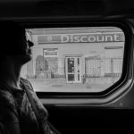 Discount Hunt - greyscale photography of woman inside vehicle