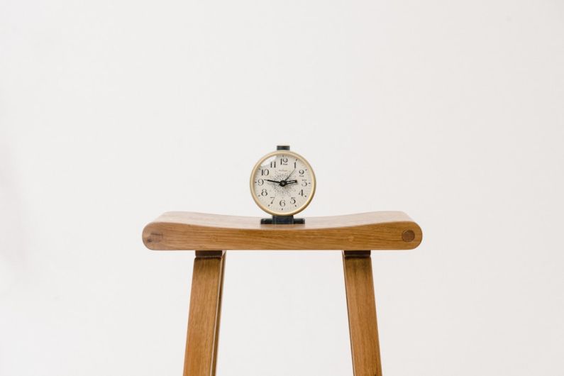 Budget Fashion - brown wooden table clock at 10 10