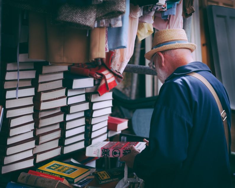 Book Bargain - man holding book