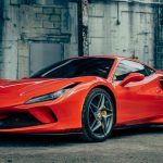 Luxury Car - red ferrari 458 italia parked near gray building