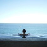 Luxury Travel - woman in water pool