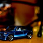 Collectibles Luxury - blue coupe toy on brown surface