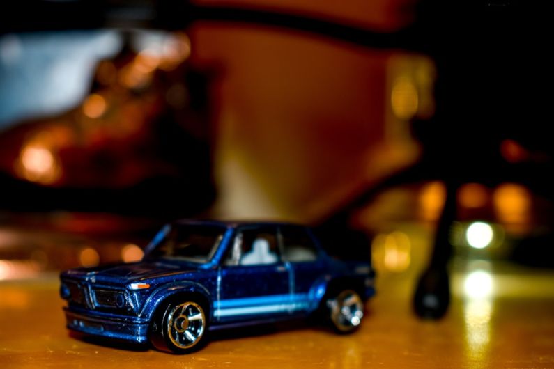 Collectibles Luxury - blue coupe toy on brown surface