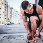 Fitness Favorite - man tying his shoes
