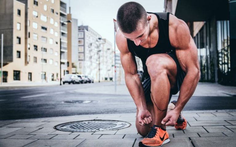 Fitness Favorite - man tying his shoes