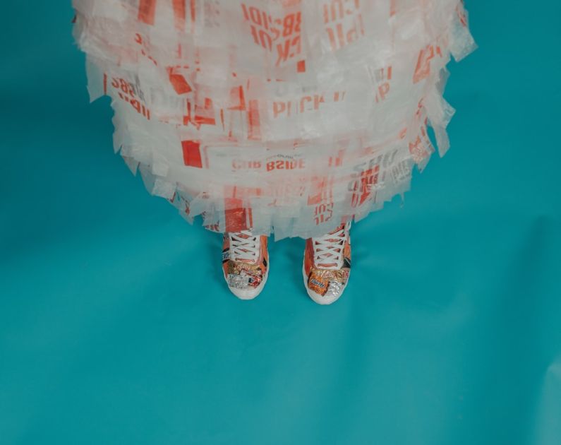 Eco Favorite - person wearing brown-and-white lace-up shoes