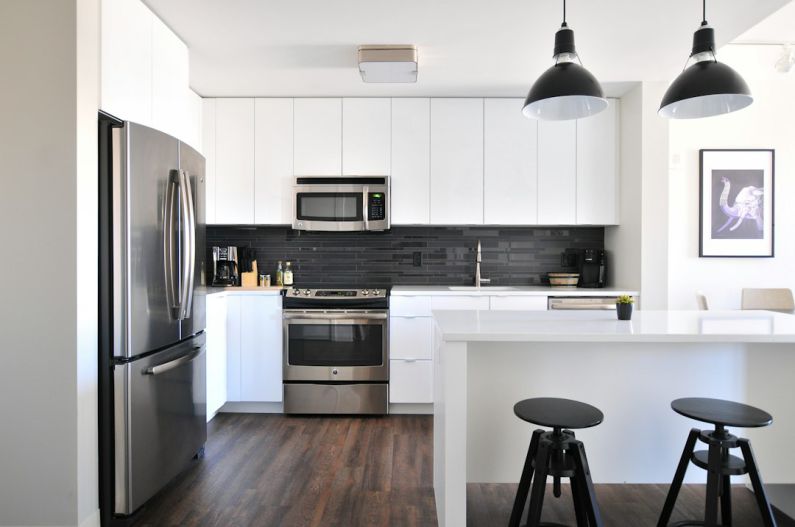Kitchen Favorite - gray steel 3-door refrigerator near modular kitchen