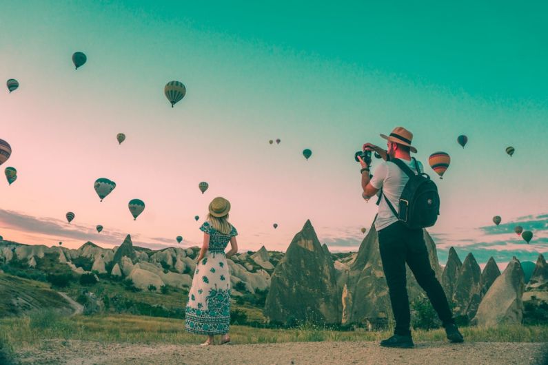 Travel Gear Favorite - man taking photo of hot air balloons