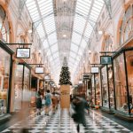 Holiday Shopping - person walking inside building near glass