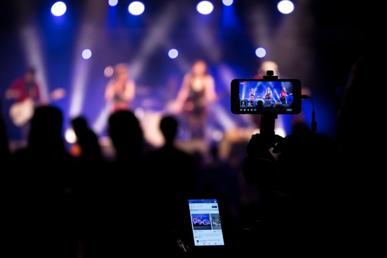 Streaming Release - people taking videos during concert