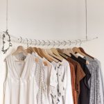 Athleisure Trend - assorted clothes in wooden hangers