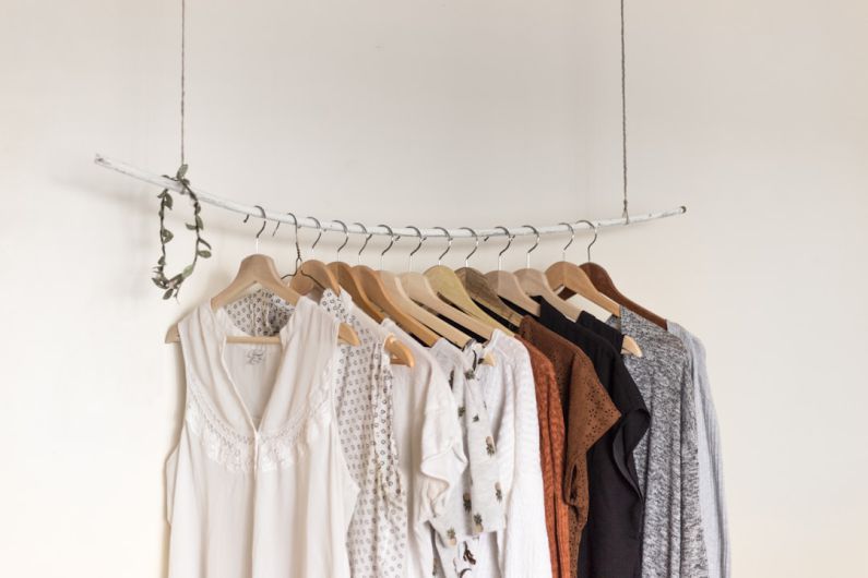 Athleisure Trend - assorted clothes in wooden hangers