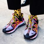 Street Style - person wearing black blue and yellow nike sneakers