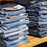 Accessories Trend - pile of blue denim jeans lot