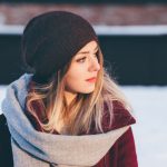 Seasonal Fashion - woman wearing black knitted cap