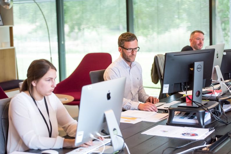 Home Office Tech - man sitting in front of table