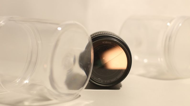 Gaming Gear - a close up of a camera lens on a table