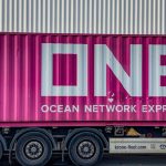 Global Shipping - a pink truck with the word ocean network express painted on it