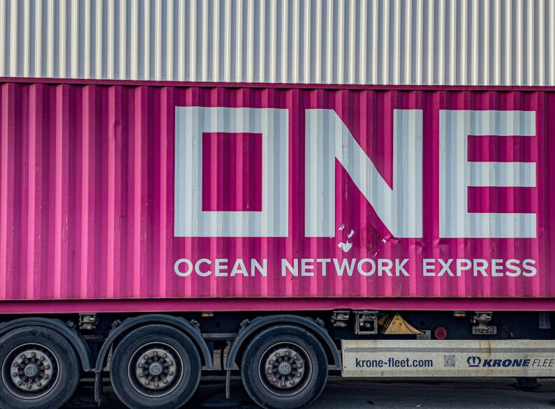 Global Shipping - a pink truck with the word ocean network express painted on it