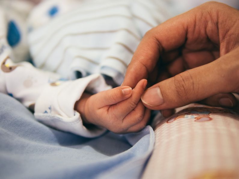 Self-care Gift - person holding baby's index finger