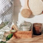 Sustainable Living - brown wooden chopping board beside clear glass jar