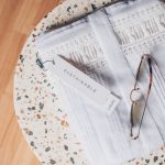 Sustainable Groceries - silver framed eyeglasses on white and blue floral textile