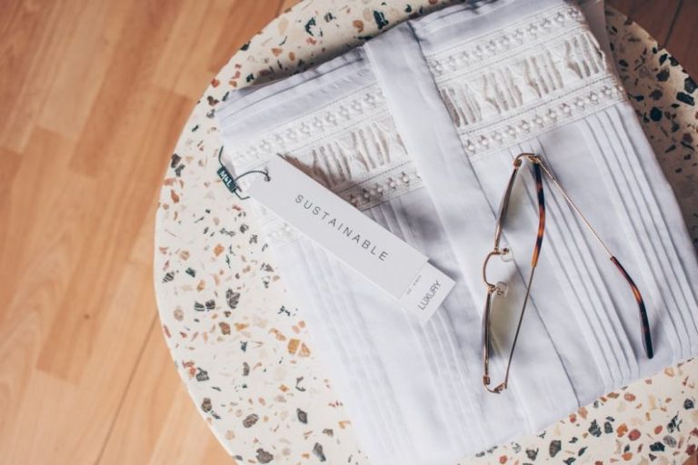 Sustainable Groceries - silver framed eyeglasses on white and blue floral textile